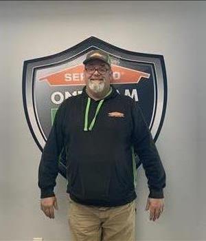Smiling male SERVPRO employee in front of 