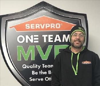 Smiling male SERVPRO employee in front of 