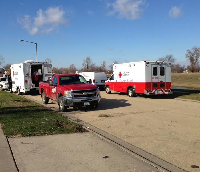 American Red Cross vehicles parked along street
