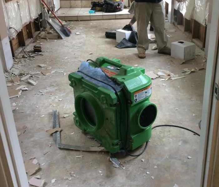 Large green air filter in a room 